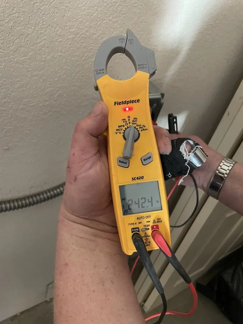 Voltage testing with clamp meter during Whole House Surge Protector in Tri-City